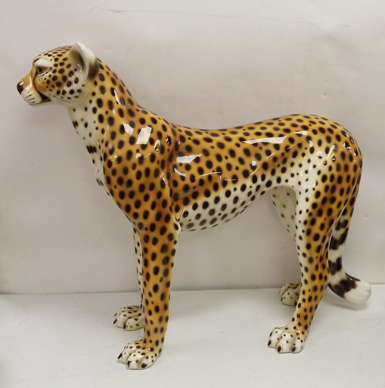 A large novelty ceramic leopard, 69cm tall